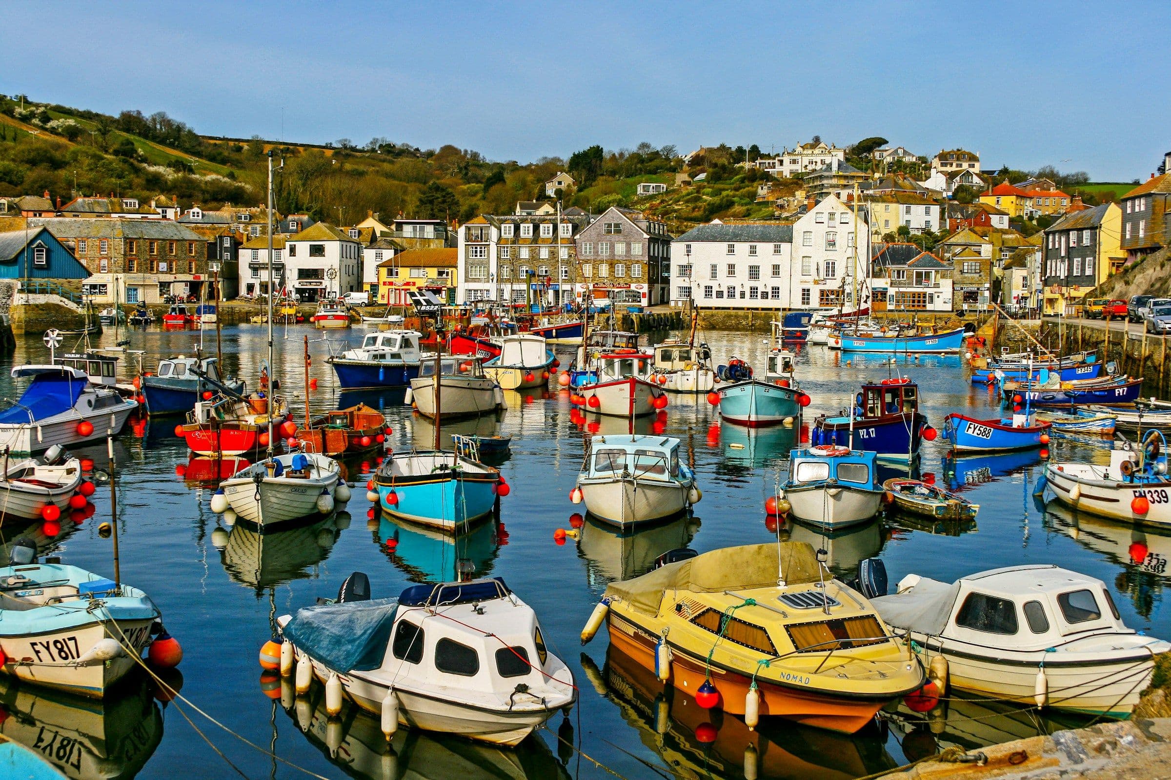 Colourful fishing boats in the harbour at Mevagissey, Cornwall.