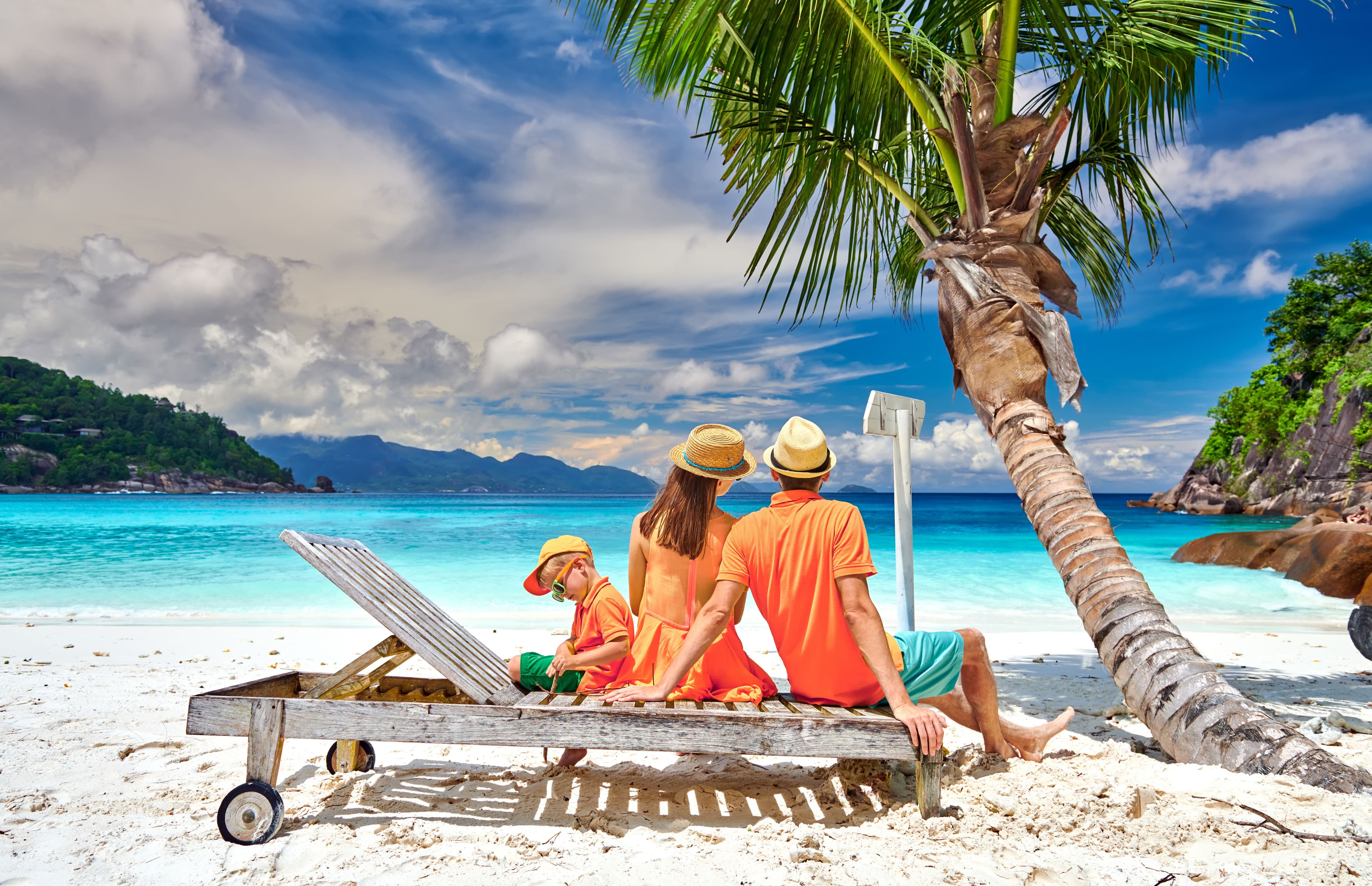 tropical beach vacation with family on white sand