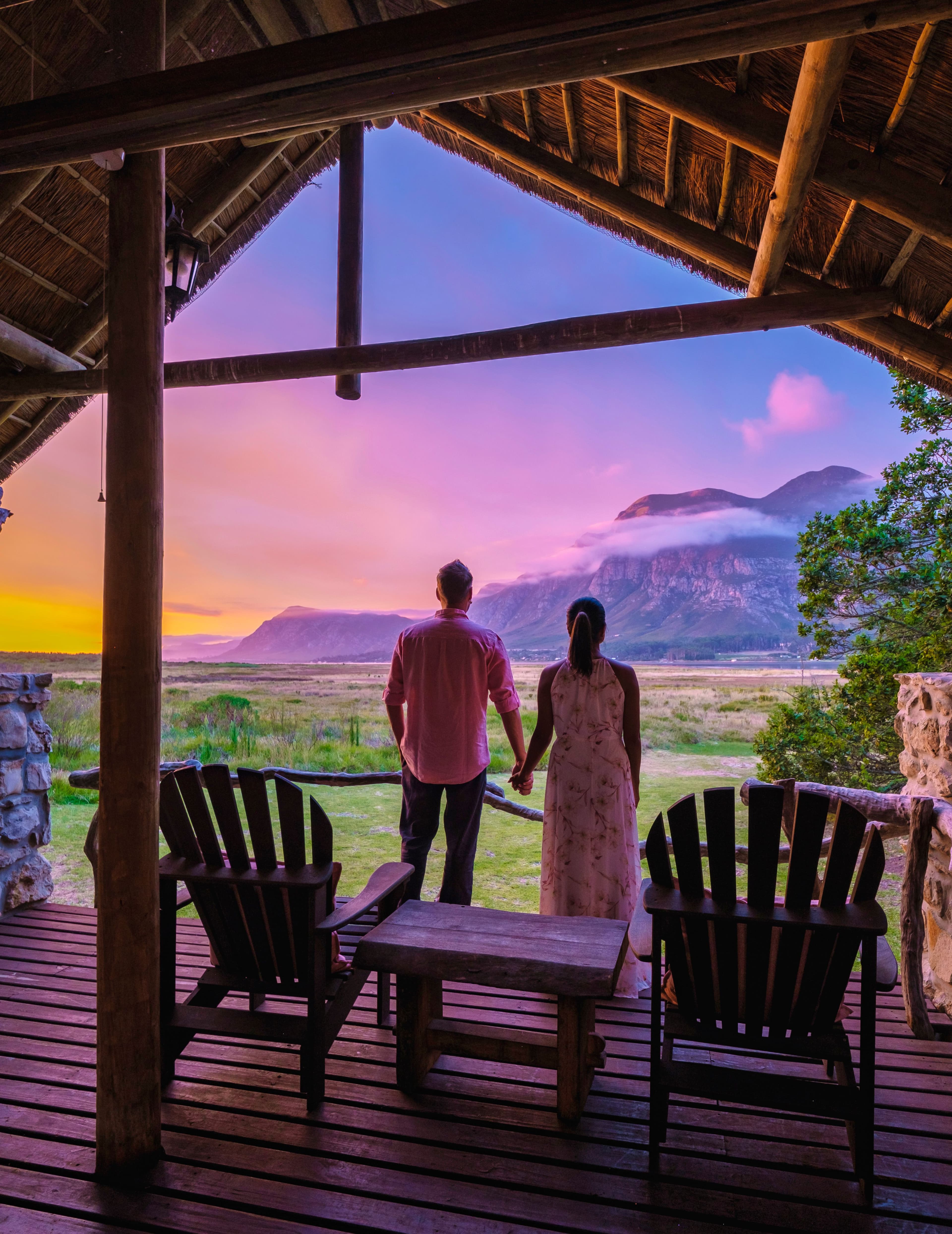 couple man and woman mid age in front of their lodge