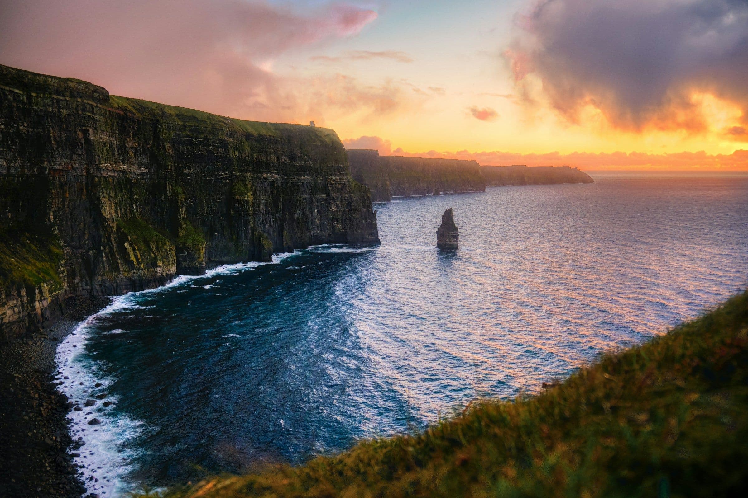 The Cliffs of Moher on the west coast of Ireland at sunset.