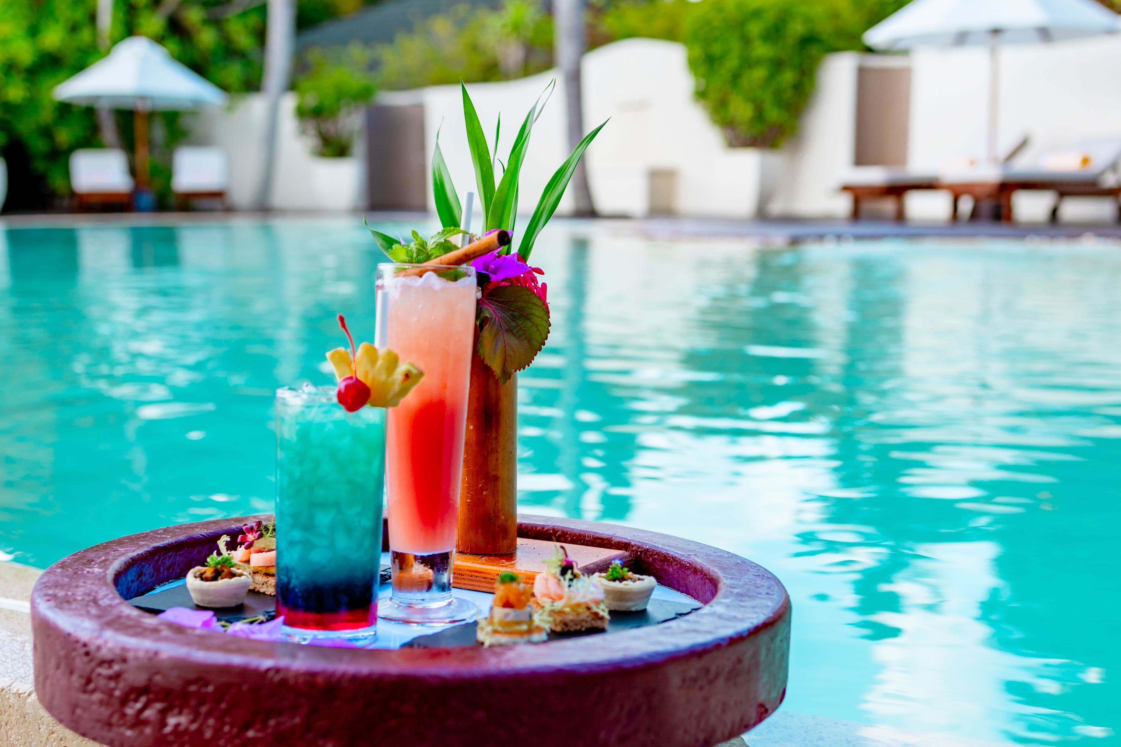 served floating tray in swimming pool with drinks