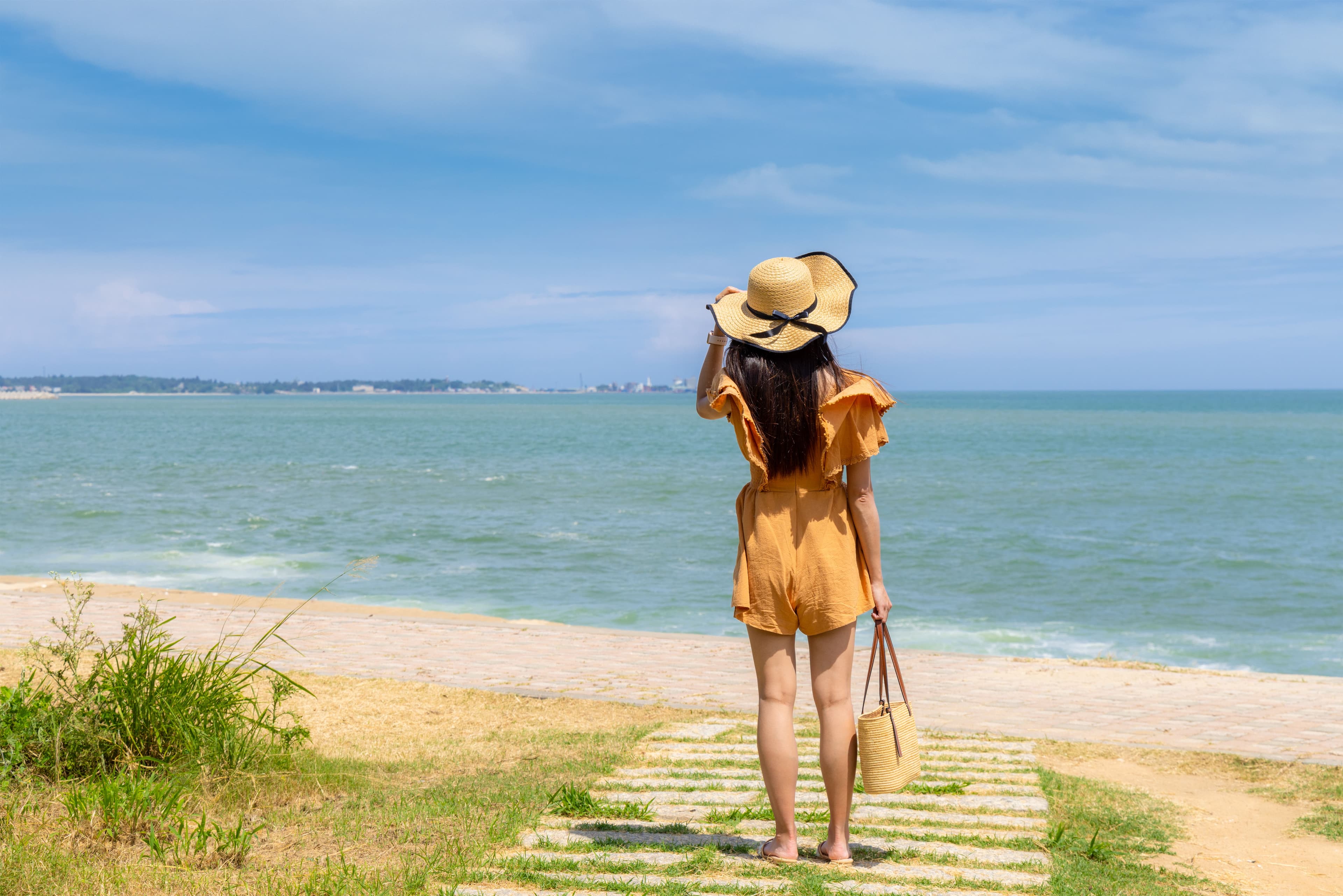 Young Woman Enjoying Vacation on Tropical Beach