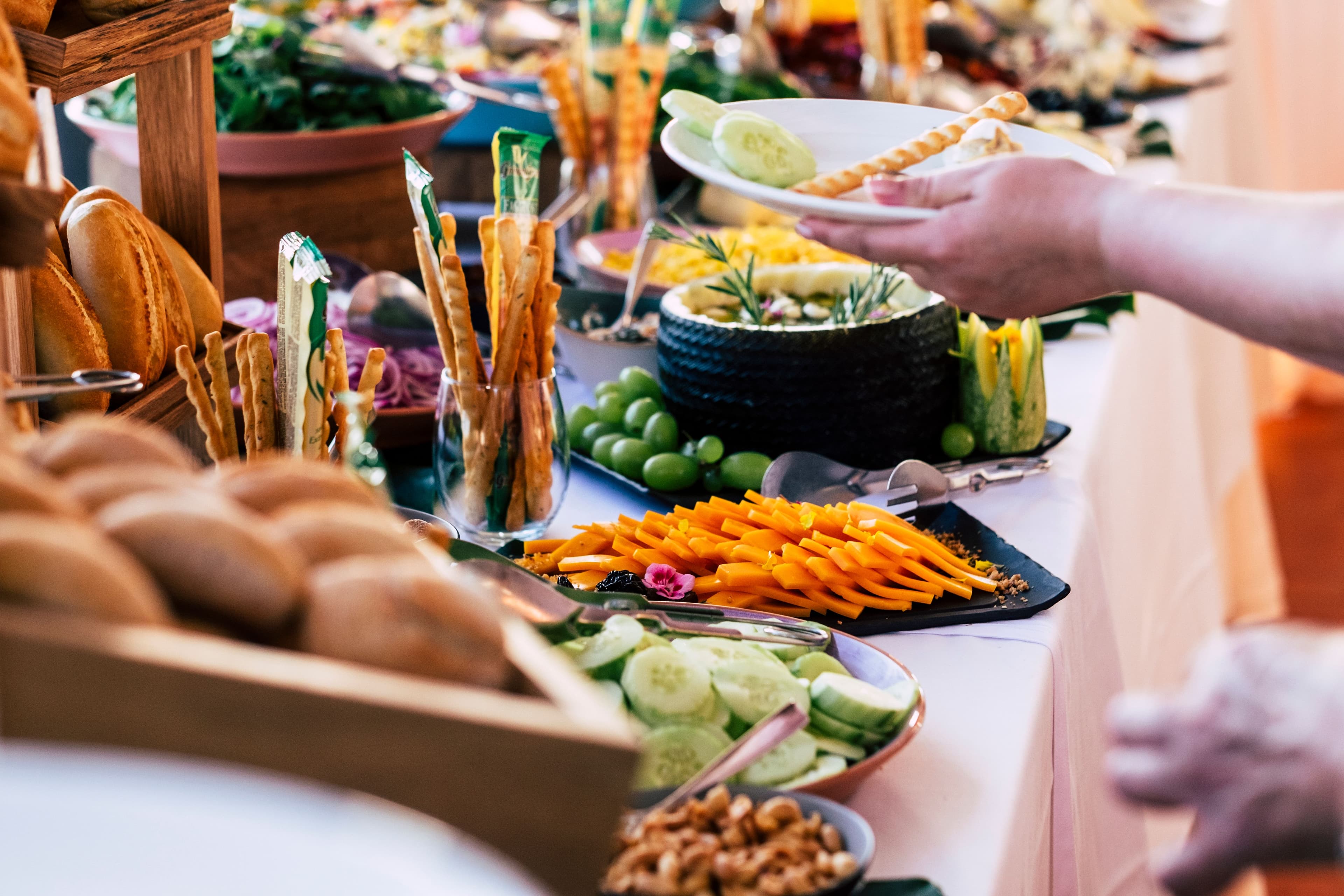 abundant buffet table with breads and salads