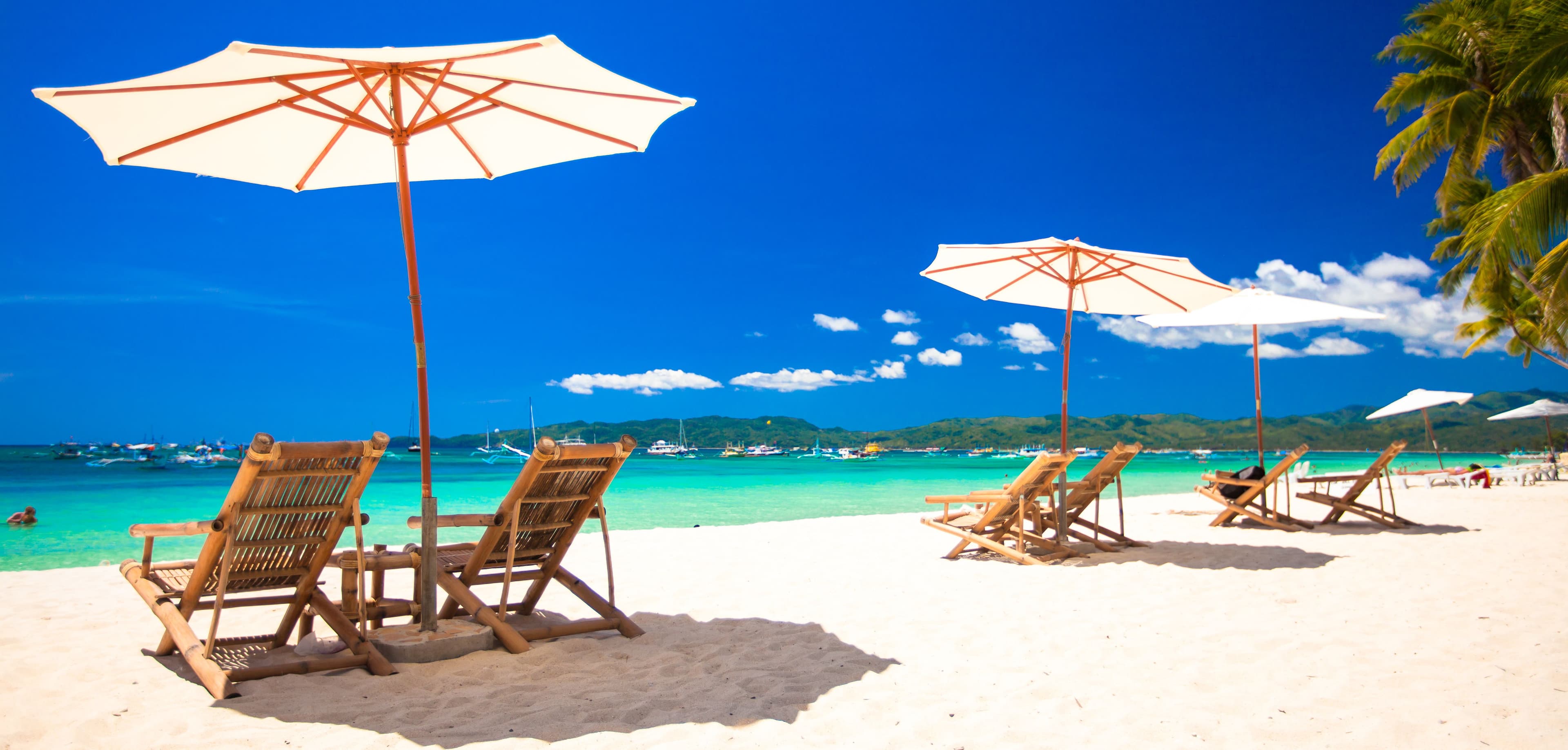 peaceful beach with lounge chairs and umbrellas