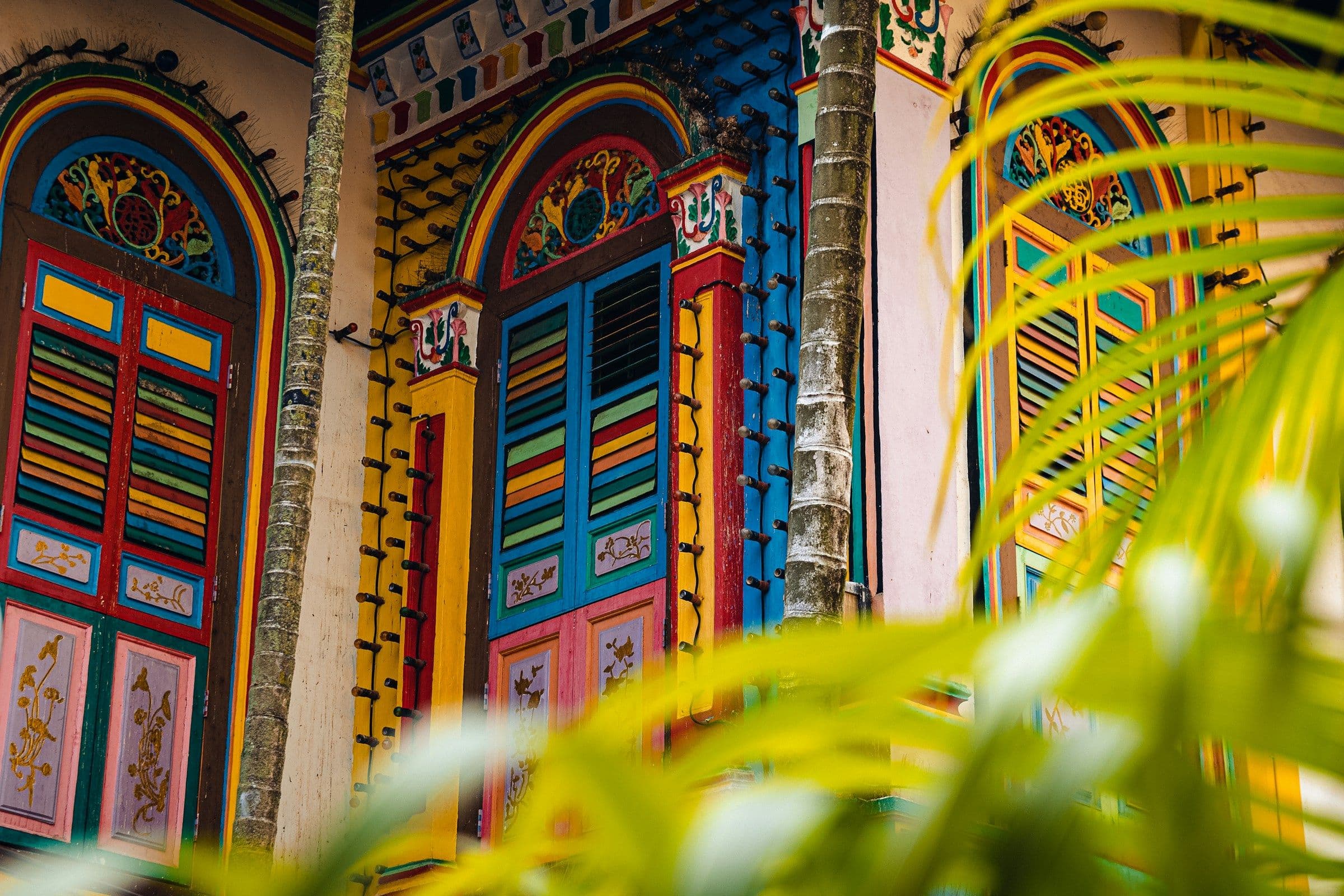 Brightly painted shutters and doors on the House of Tan Teng Niah in Little India, Singapore.