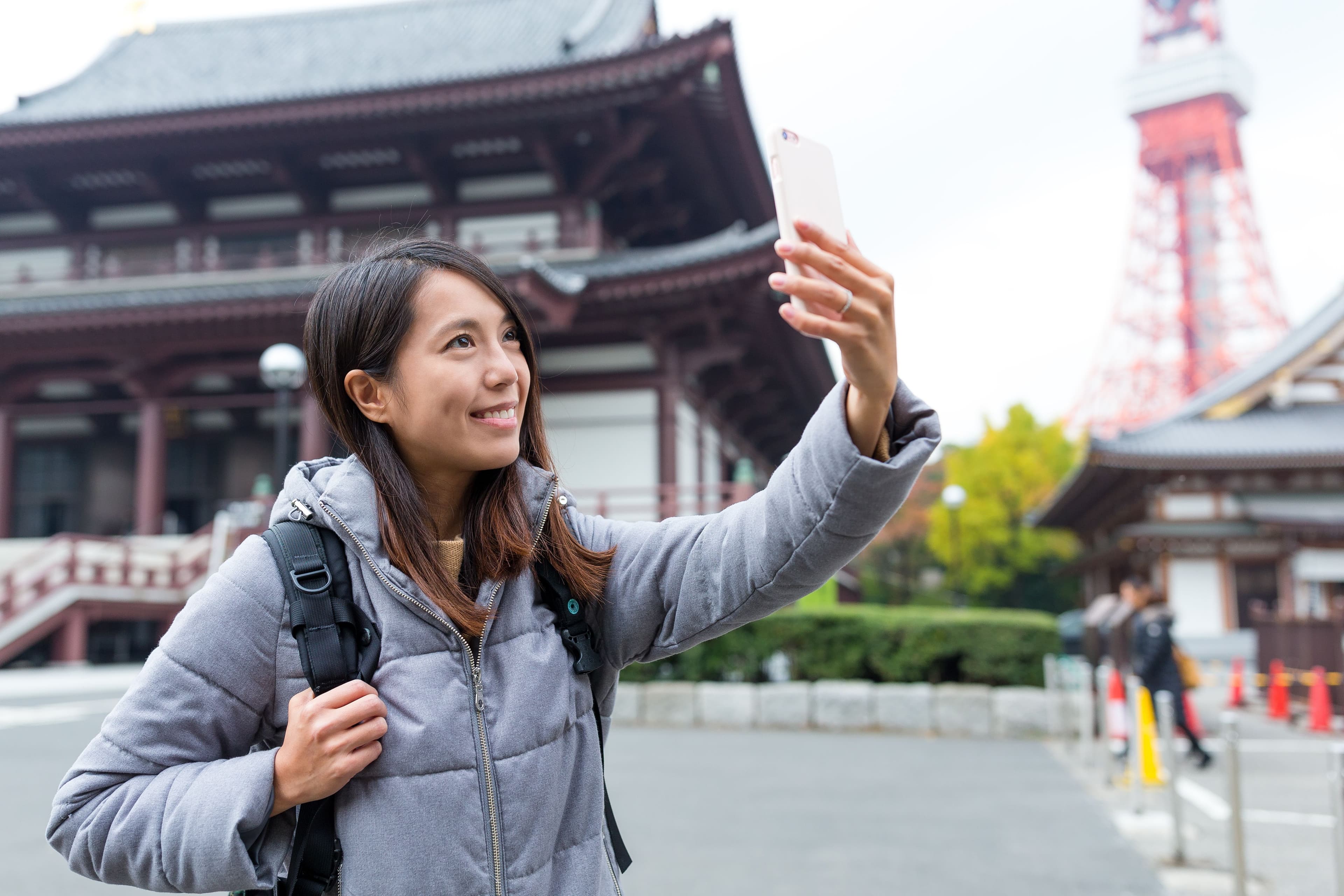 Woman taking selfie in Tokyo city