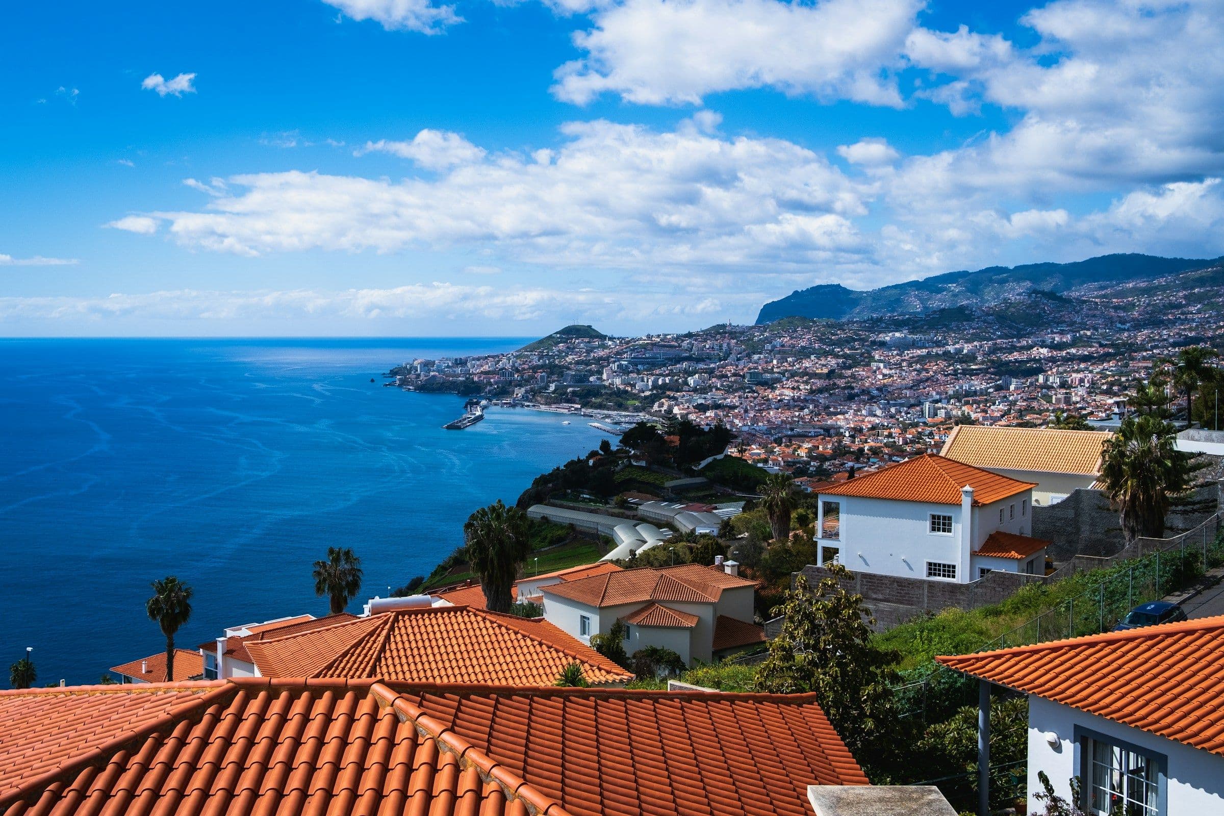 Terracotta rooftops above the bay of Funchal on the coast of Madeira