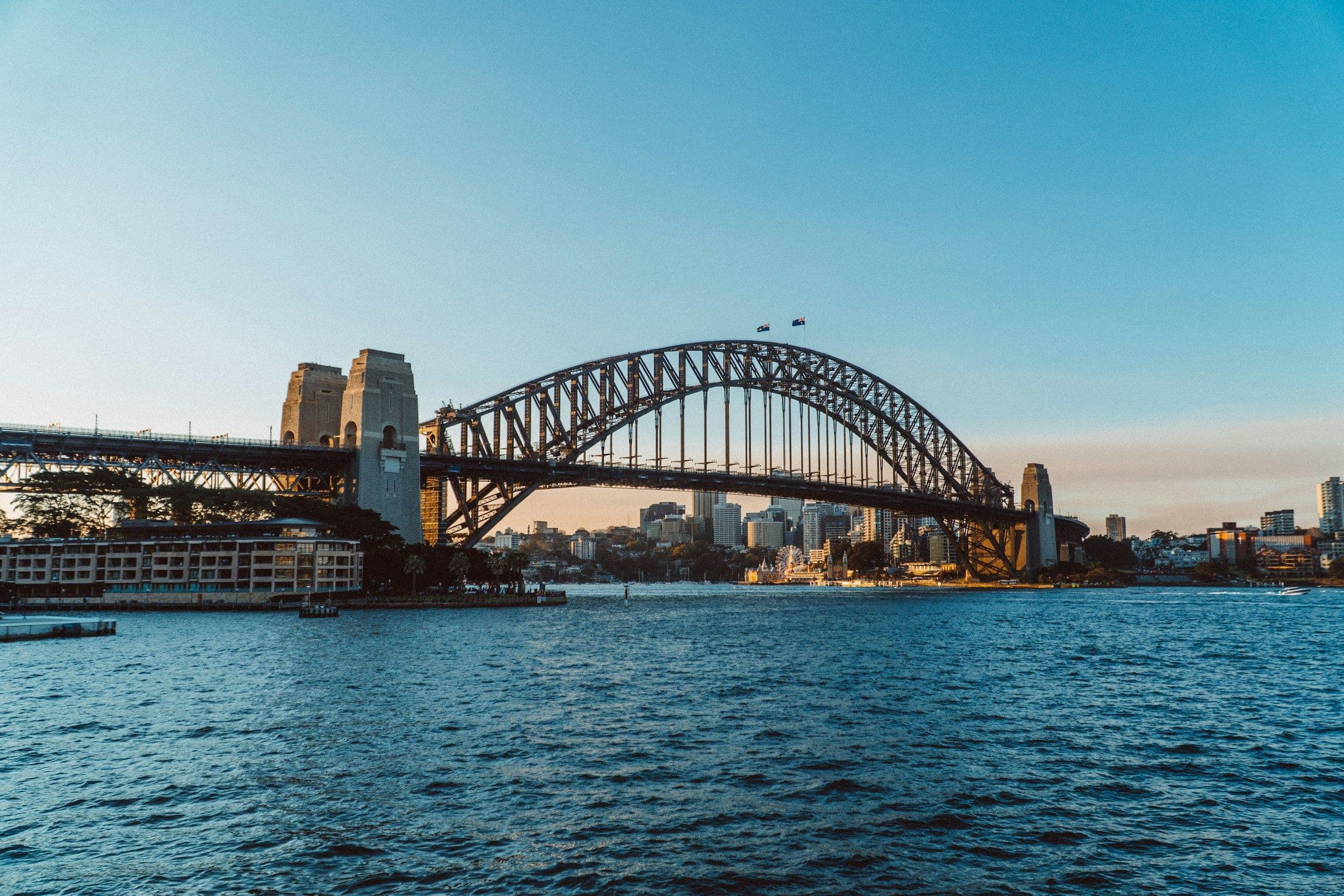 Sydney Harbour Bridge spanning the harbour on a clear day.