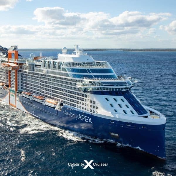 A cruise ship sailing through blue water.